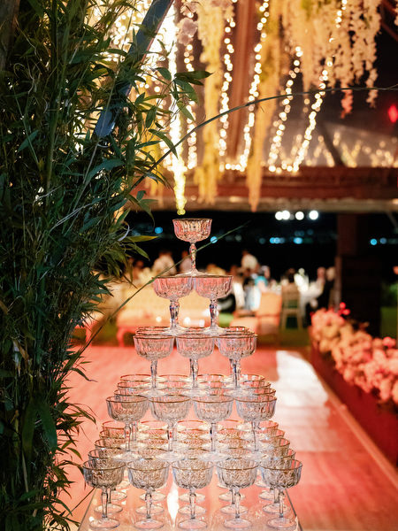 Champagne tower display set up during luxury Island Resort Athens Riviera wedding reception