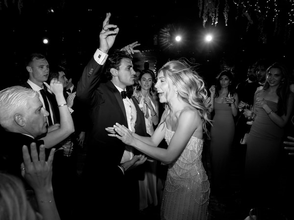 Bride and groom celebrating on dance floor during luxury Island Resort Athens Riviera wedding reception