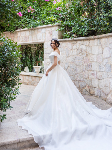 Bride walking in wedding gown at Margie Hotel