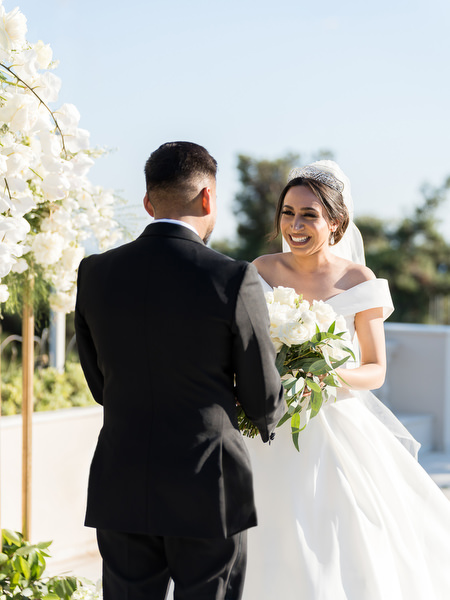 Couple exchanging vows during symbolic ceremony at Golf Privé Glyfada