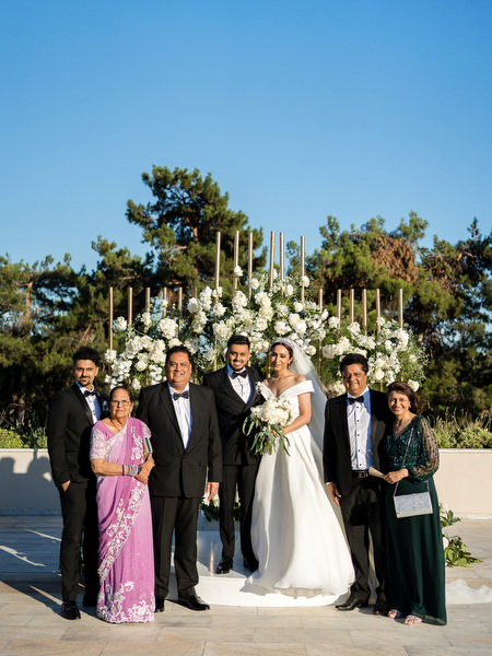 Bride and groom with family and friends after Athens wedding
