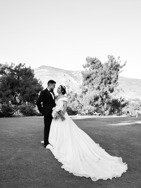 Bride and groom portrait in golf course landscape in Athens