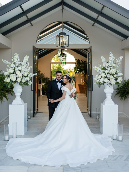 Bride and groom portrait inside chapel-like pavilion