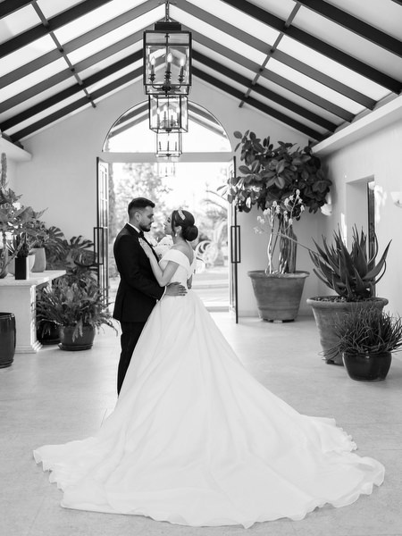 Black and white romantic portrait inside Athens golf prive pavilion