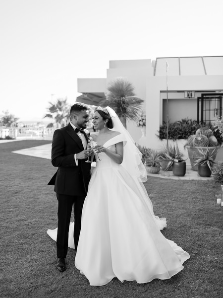 Bride and groom walking together after symbolic wedding ceremony in Athens