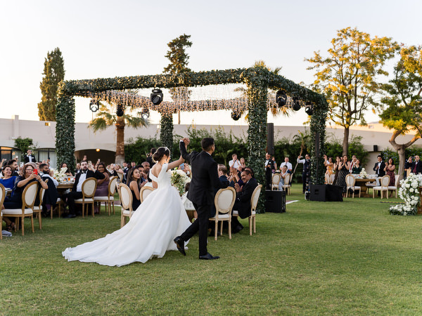 Couple entering wedding reception at Golf Privé Glyfada