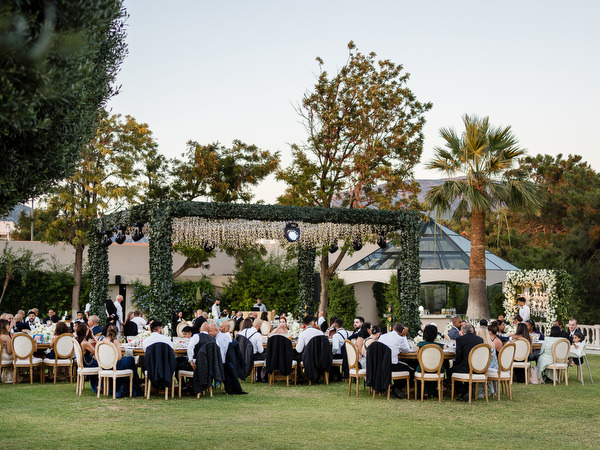 Reception table styling with white florals at Athens Riviera wedding