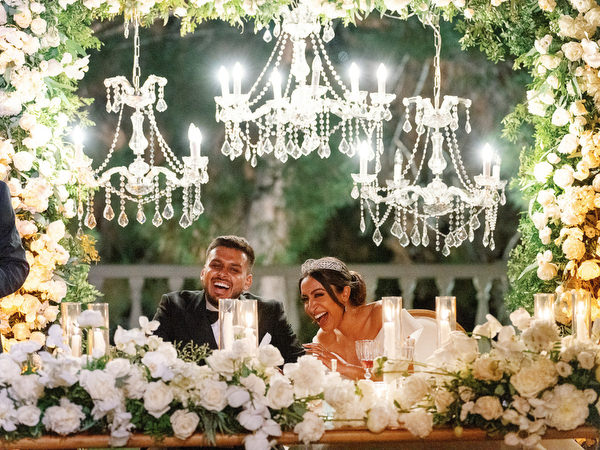 Groom and bride reacting during emotional speech at Golf Privé Glyfada wedding