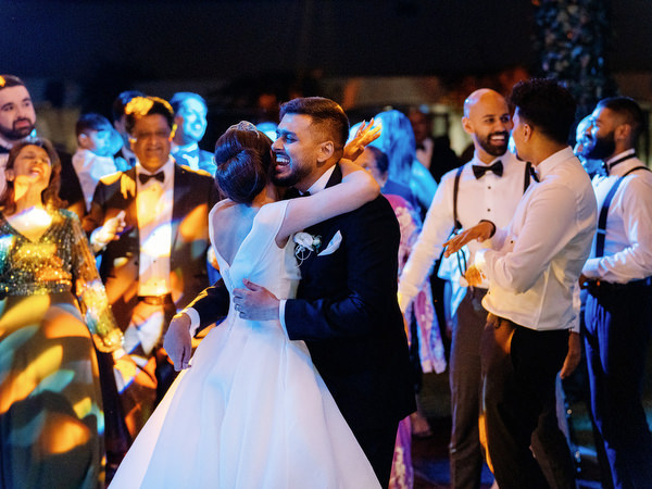 Bride and groom dancing during evening party at Golf Privé Glyfada