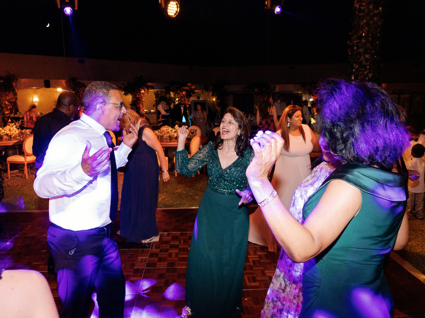 Guests dancing together late night at Athens Riviera wedding party