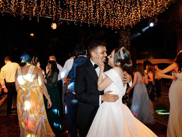 Romantic portrait of couple under evening lights at Golf Privé Glyfada
