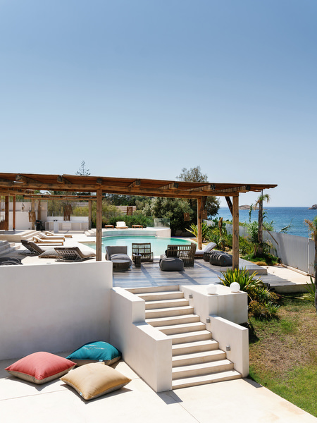 Modern white villa terrace with steps leading to pool and sea views on the Athens Riviera