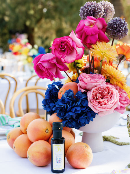 Colorful floral arrangement with roses, hydrangeas, and citrus accents at luxury Athens wedding