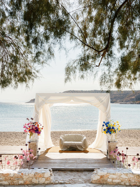 White canopy set directly on the beach overlooking the Athens Riviera coastline