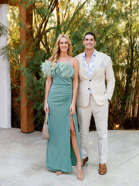 Wedding guests posing beneath trees at luxury Athens destination wedding
