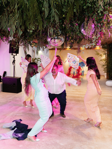 Guests dancing beneath mirrored disco balls during luxury Athens Riviera wedding