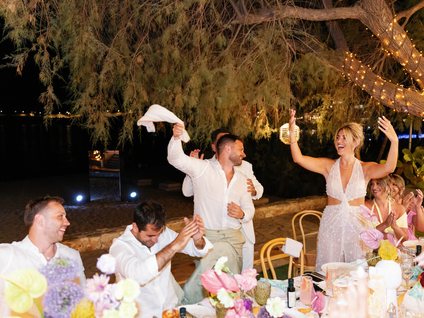 Guests standing and cheering during luxury Athens Riviera wedding reception