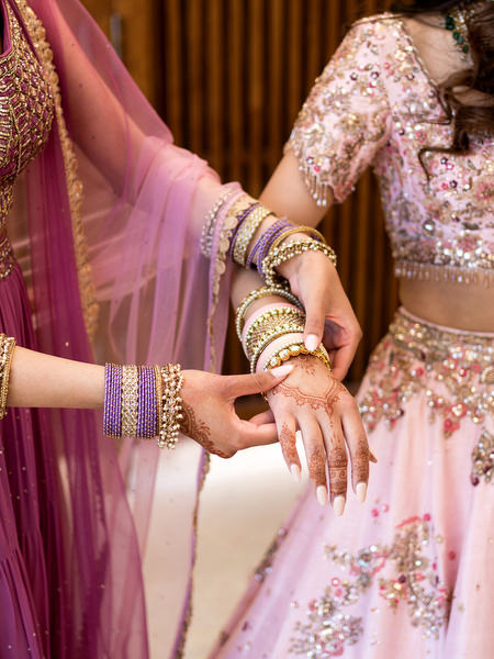 Close-up of bridal mehndi and pink dupatta at Private House Island Resort Hindu wedding in Greece.