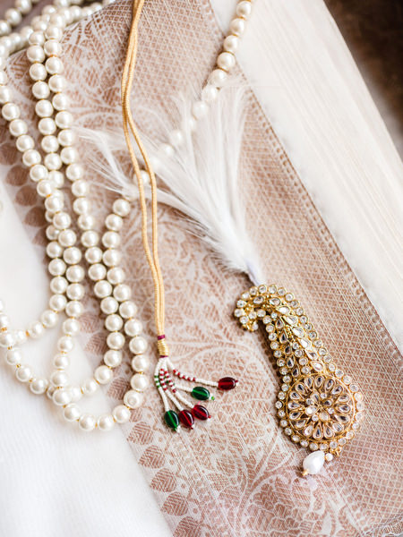 Indian groom necklace and pearl accessories styled for Hindu wedding at Margi Hotel Athens.