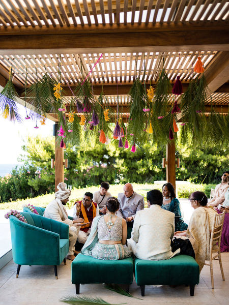 Hindu wedding rituals taking place under floral mandap at Private House Island Resort Athens Riviera.