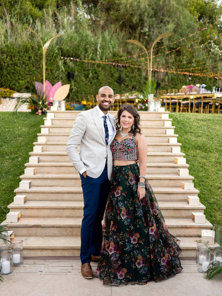 Wedding guests posing on staircase at Private House Island Resort Athens Riviera during Indian reception.