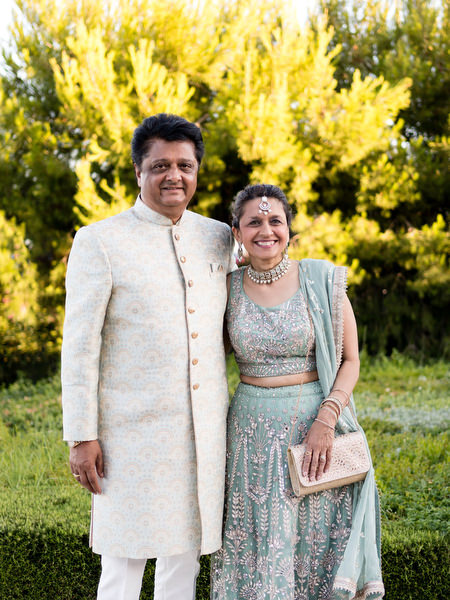 Parents of the couple posing in traditional Indian attire at Private House Island Resort Athens Riviera.