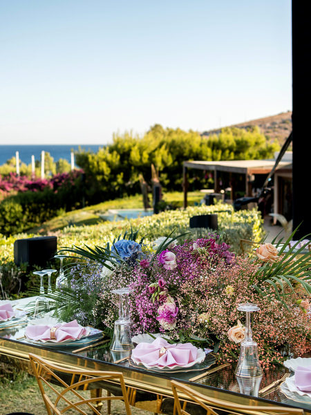 Sunset view of Private House Island Resort wedding reception overlooking the Athens Riviera coastline.