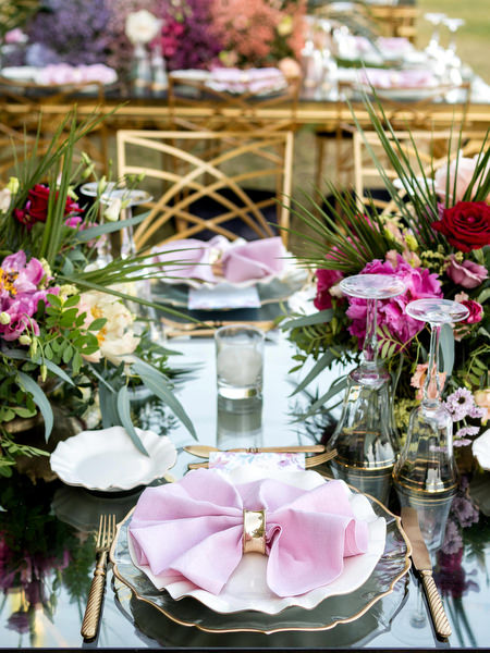 Pink and purple floral reception decor at Private House Island Resort Athens Indian wedding.