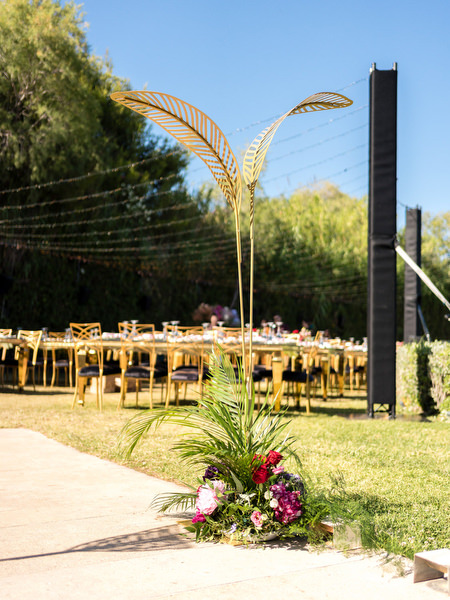Modern gold sculptural installation beside outdoor wedding setup at Private House Island Resort Athens.