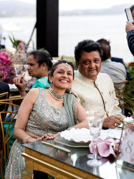 Parents smiling at Indian wedding reception during sunset at Private House Island Resort Athens.