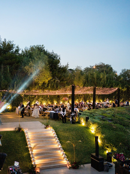 Evening Indian wedding reception overlooking the sea at Private House Island Resort Athens Riviera.