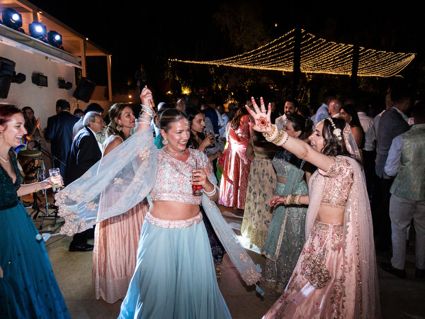 Crowded Bollywood-style dance floor at Private House Island Resort Indian wedding in Athens.
