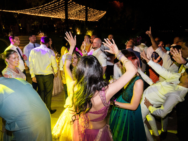 Crowded Bollywood-style dance floor at Private House Island Resort Indian wedding in Athens.