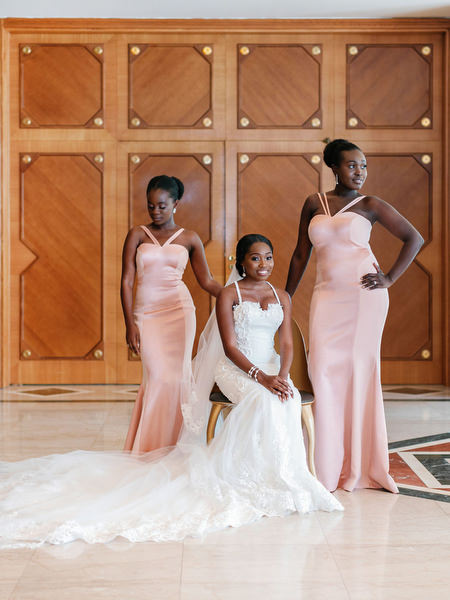 Bride posing with bridesmaids at The Margi Hotel Athens Riviera luxury Nigerian destination wedding.