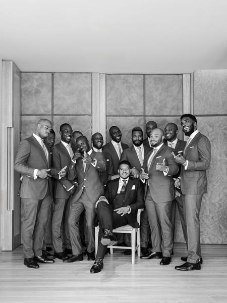 Groom with groomsmen group portrait during large-scale luxury Nigerian wedding in Athens Greece.