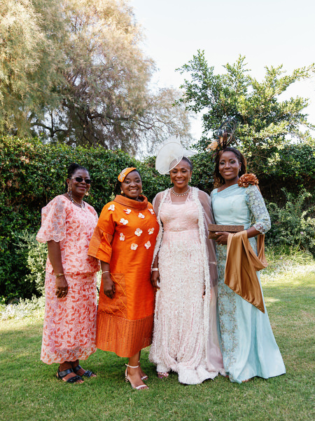 Family group in vibrant traditional attire at Ble Azure luxury Nigerian wedding ceremony on the Athens Riviera.