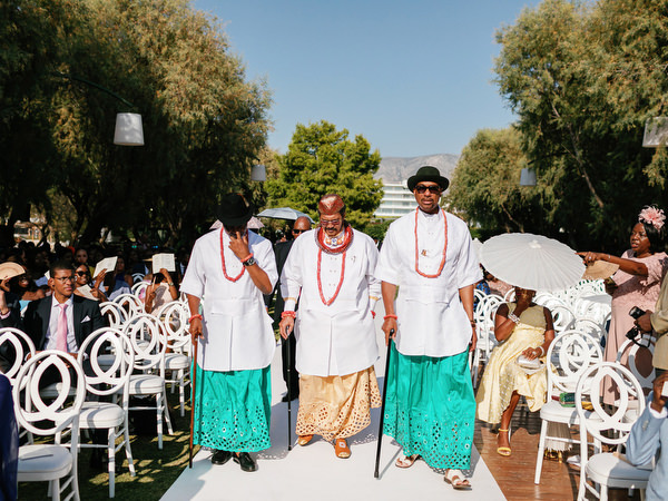 Nigerian elders walking ceremony aisle at Ble Azure luxury destination wedding in Athens Riviera.