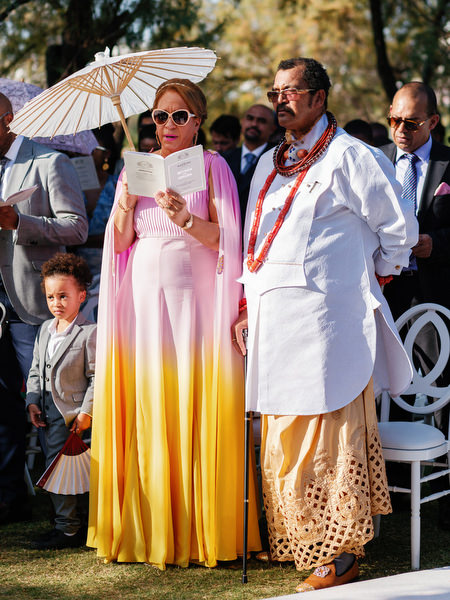Elders seated at Ble Azure ceremony wearing traditional Nigerian attire during luxury Athens Riviera wedding.