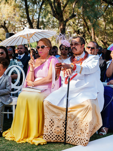 Family members seated during Ble Azure ceremony at luxury Nigerian destination wedding in Athens Greece.