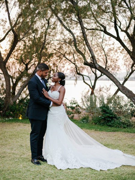 Bride and groom portrait at sunset in garden at Ble Azure luxury Nigerian wedding on the Athens Riviera.