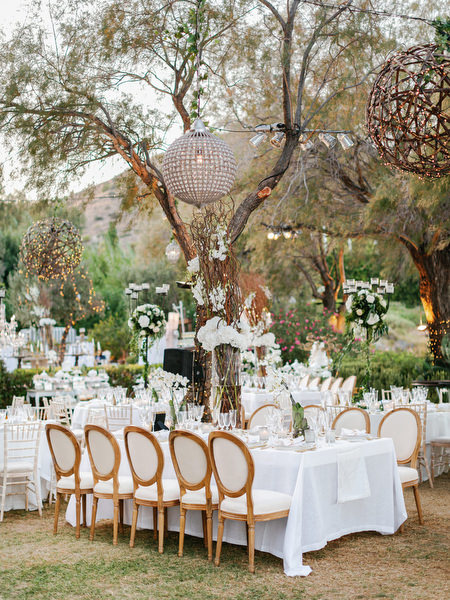 Elegant reception table styling with gold chairs at Island Resort The Residence Nigerian destination wedding in Athens Riviera.