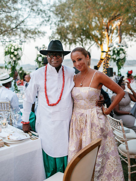 Guest in traditional Nigerian outfit posing at Island Resort The Residence luxury wedding reception in Athens.