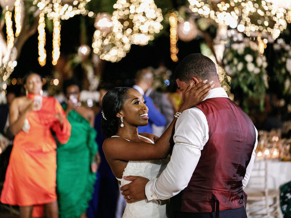 Wedding guests dancing energetically at Island Resort The Residence Nigerian destination wedding in Athens Riviera.