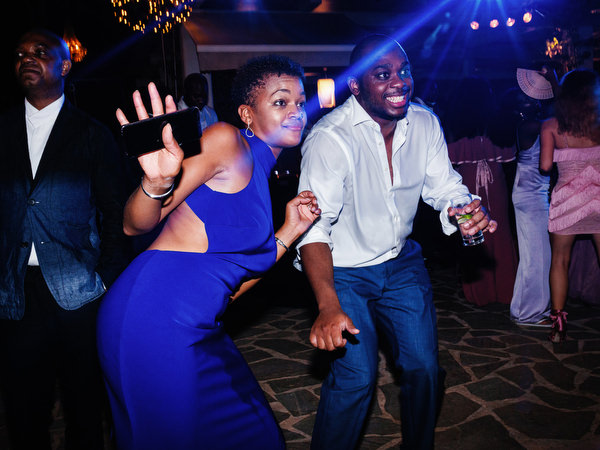 Guests dancing together late at night at Island Resort The Residence Athens Riviera wedding celebration.