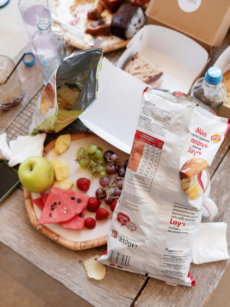 Casual pre-ceremony spread with fruit, chips, and drinks during bridal preparations