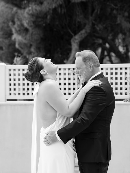 Bride embracing her father during heartfelt pre-ceremony moment