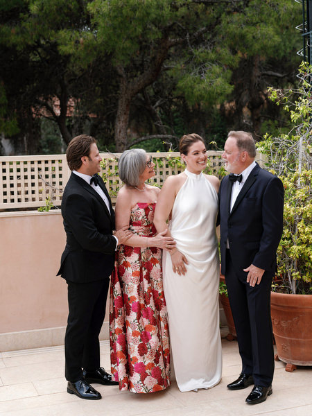 Bride standing with her parents and sibling before Jewish ceremony at Island Resort
