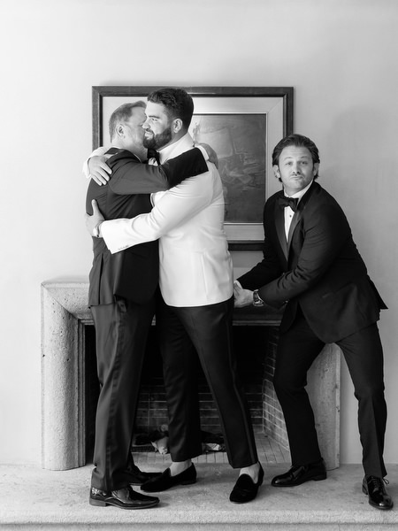 Groom embracing friend in heartfelt pre-ceremony moment at Margi luxury hotel