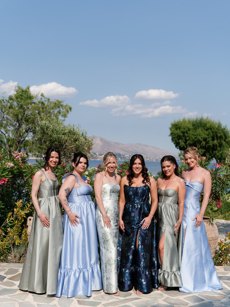 Bridal party posing together against coastal backdrop before Jewish ceremony