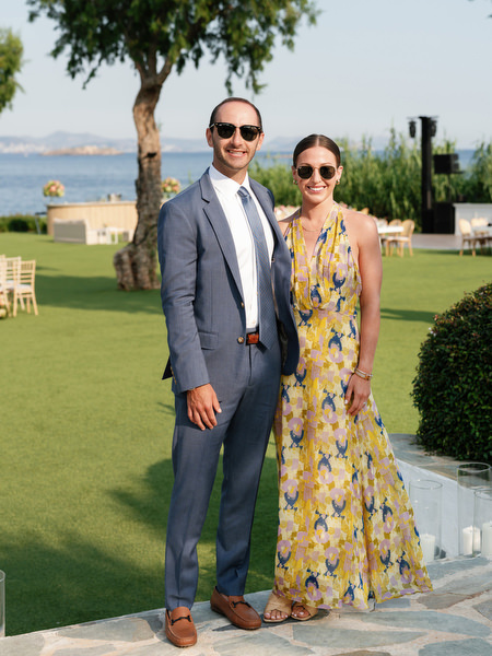 Wedding guests posing on the lawn before Jewish ceremony